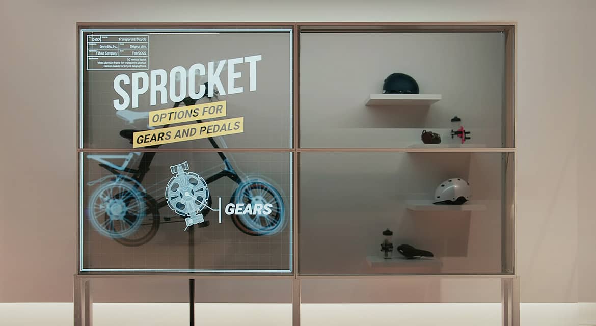 Product information is displayed on the show window screen consisting of Transparent OLEDs, and the actual bicycle is seen behind the transparent screen.
